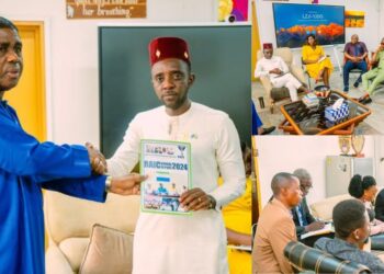 RAIC Boss hands over Annual Report to MOICE’s Chernoh Bah