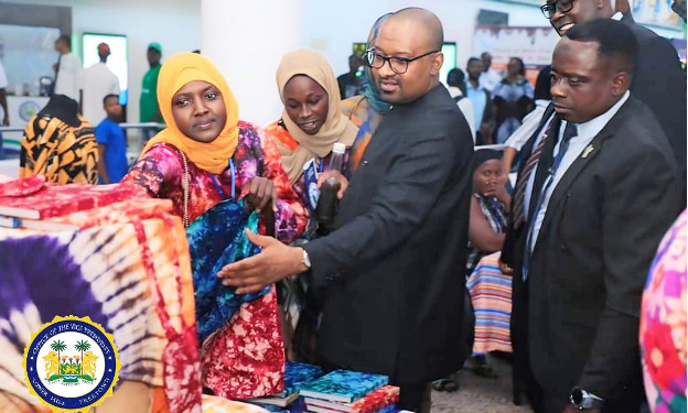 By Aminata Turay Sierra Leone’s Vice President, Dr Mohamed Juldeh Jalloh, has demonstrated strong support for homegrown products when he attended the Made in Sierra Leone Exhibition on Thursday, 23rd October 2025, at the Bintumani Conference Centre in Freetown. Rather than simply touring the booths, the Vice President personally bought items from local entrepreneurs, underscoring his commitment to the “Produce Salone, Buy Salone” campaign. The atmosphere was warm and lively as VP Juldeh Jalloh moved through the exhibition hall, stopping to chat with small business owners, listen to their stories, and appreciate their creativity. His genuine engagement reflected a leader who values hard work, innovation, and the aspirations behind every locally made product. He also patronised several farmers and producers, purchasing a variety of homegrown items to show confidence in Sierra Leone’s agriculture and manufacturing sectors. One of the most heartwarming moments came when he bought a tray of locally produced eggs from a smiling vendor, a simple but powerful gesture that showed leadership in action. He also purchased natural skincare products from a female entrepreneur, examining the packaging with interest and appreciation. Speaking at the event earlier in the day, Dr Juldeh Jalloh encouraged Sierra Leoneans to take pride in locally made goods and view every purchase as an investment in national growth. “When we buy what we produce, we create jobs, strengthen our economy, and build confidence in our own people,” he said. For many exhibitors, the Vice President’s personal patronage meant more than just a sale. It was a gesture of recognition and hope. His presence reminded everyone that building Sierra Leone’s future begins with believing in and supporting what is proudly made in Sierra Leone.